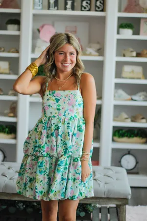 Floral printed, spaghetti strap dress with tiered bubble hem and a smocked back detail.